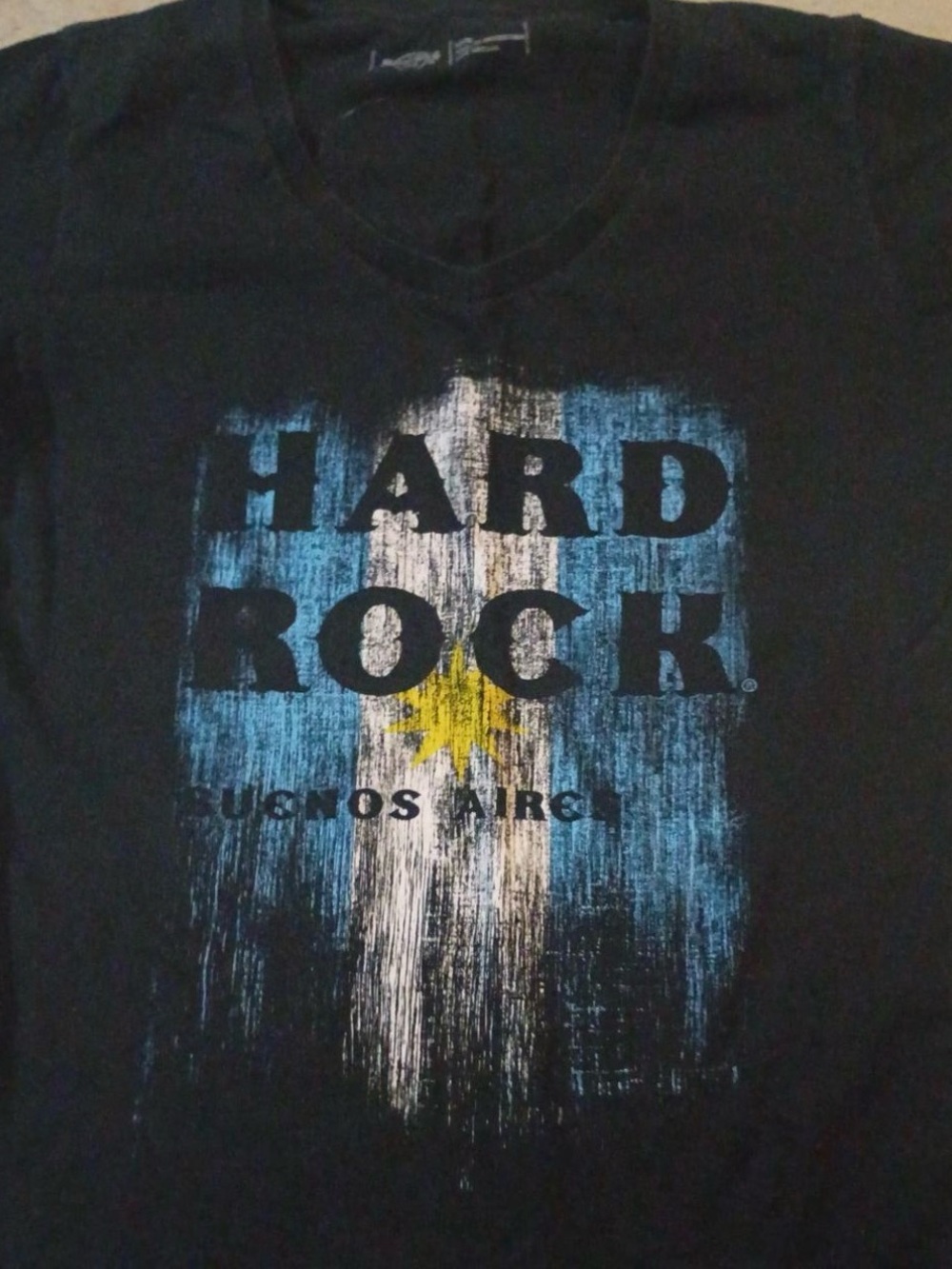 Hard Rock Cafe Black Tee with Blue, White & Yellow Graphic made in Argentina